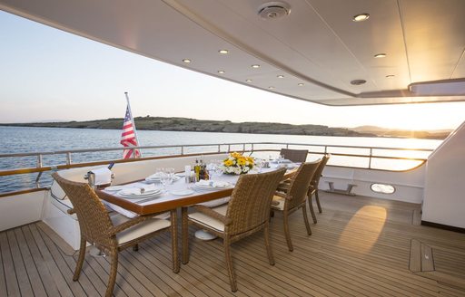 alfresco dining setup on main deck aft of luxury yacht NOMI 