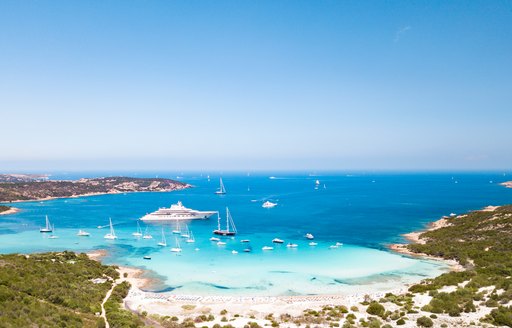 Yachts anchored in beautiful turquoise waters in La Maddalena Islands in Sardinia, Italy