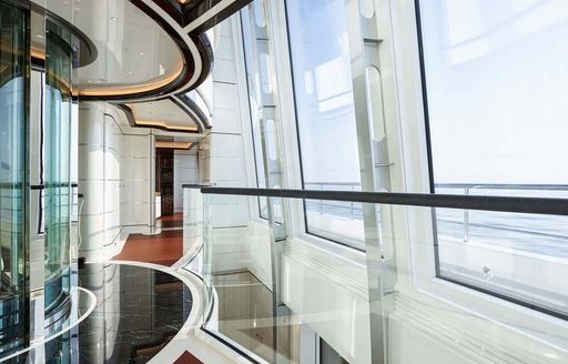 EXCELLENCE yacht atrium with glass panels and sea views