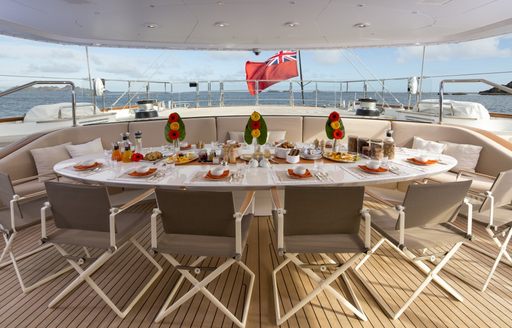alfresco dining prepared for a delicious dinner aboard luxury yacht PANTHALASSA 