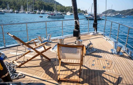 Bow seating area with deckchairs onboard sailing yacht charter NORTH WIND