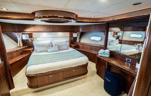 vip suite on motor yacht chess, with blue and wood color scheme