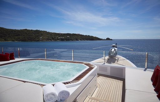 spa pool forward on the sundeck with view over the helipad on board charter yacht AQUARIUS 