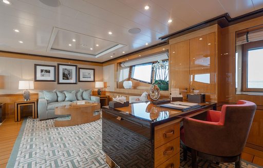 Study and lounge area in the Master cabin onboard Charter yacht SERENITY J