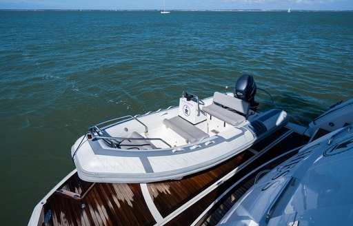 Hydraulic swim platform with tender onboard charter yacht CHESS
