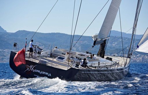 luxury yacht SHAMANNA cuts through the water on a luxury yacht charter in the Caribbean