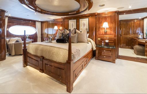 classically styled master suite with skylight above bed on board charter yacht ‘One More Toy’