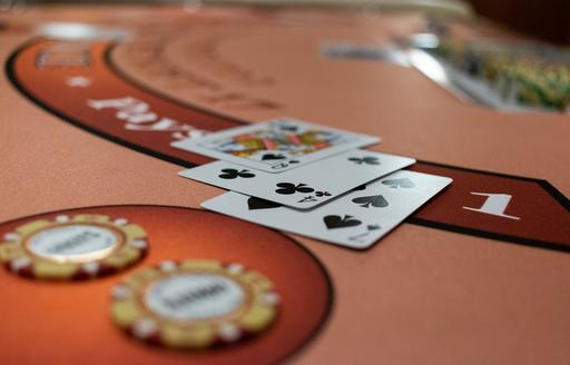 cards and chips on a poker table that is in a luxury charter yacht 