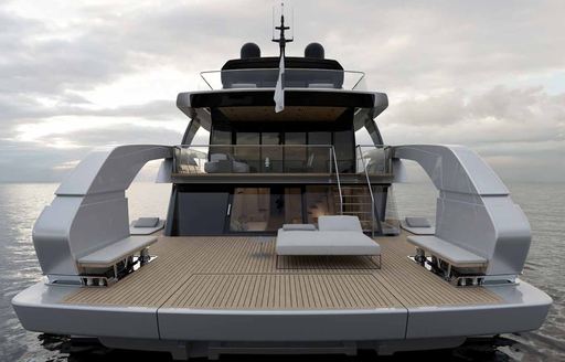 Overview of the swim platform onboard Sanlorenzo SX100, with benches to each side and a dual sunlounger aft.