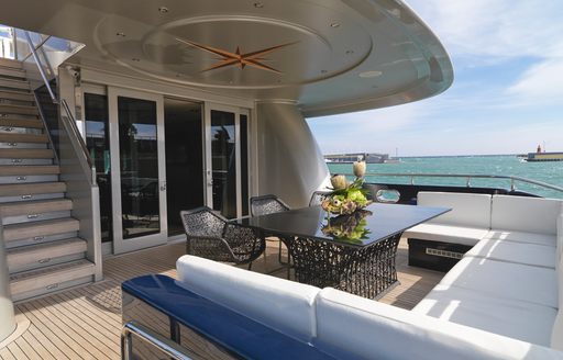 Aft deck dining area on board M/Y One Blue