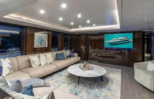 Comfortable setting area on superyacht OCULUS with large TV screen 