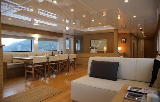 Interior on Superyacht Ottawa IV with formal dining table and sofa