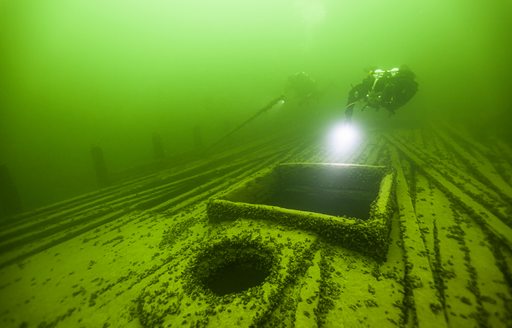 Scuba diver examines a wreck in Hanko, Finland
