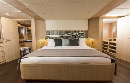 master suite with large bed on board charter yacht THEORIS 