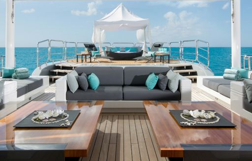 Sun deck dining with sofa seating on board superyacht SIREN