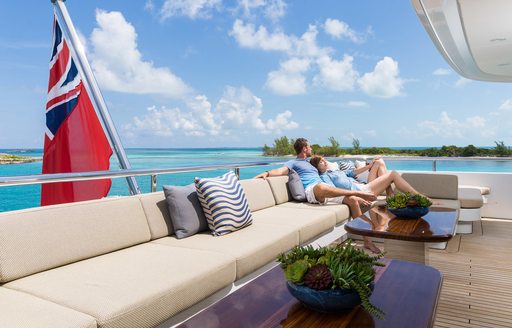 charter guests relaxing onboard luxury superyacht charter 
