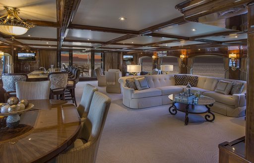 A collection of traditional and classic furnishings in the main salon of superyacht Silver Lining