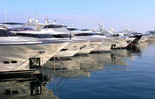 Yachts lined up in a Mediterranean harbour