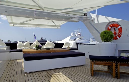 Comfortable seating on board sundeck of superyacht tropicana
