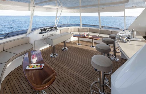 bar and seating covered by Bimini on board charter yacht AMITIÉ 