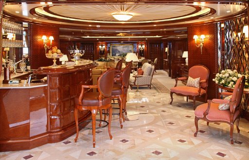 Salon onboard private yacht charter ST DAVID with wet bar in the foreground
