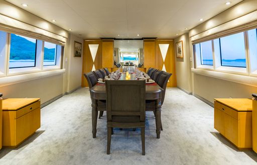 large formal dining table in main salon of charter yacht ‘Sea Falcon’ 