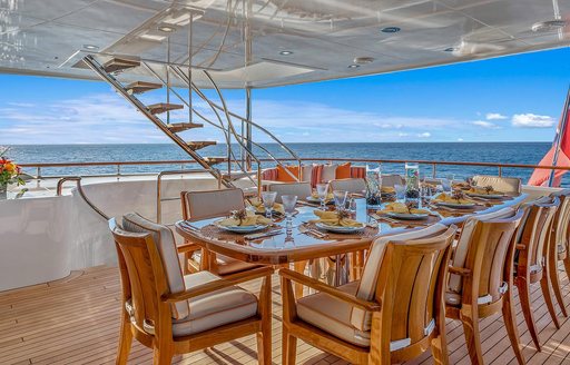 al fresco dining area on the upper deck aft of luxury yacht AVALON 