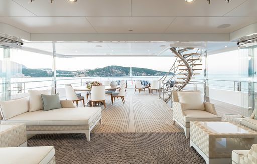 Upper al fresco deck with sofa seating on superyacht JOY