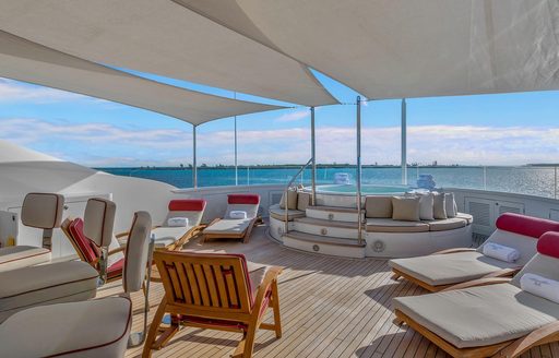 sun loungers and spa pool under shade on the sundeck of superyacht AVALON 