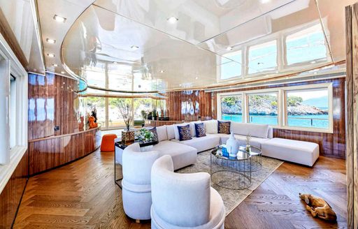 Main salon onboard charter yacht DALOLI, spacious lounge area with large windows