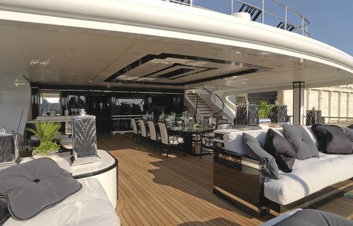 large upper deck aft with alfresco dining option and seating areas aboard superyacht ‘Silver Angel’