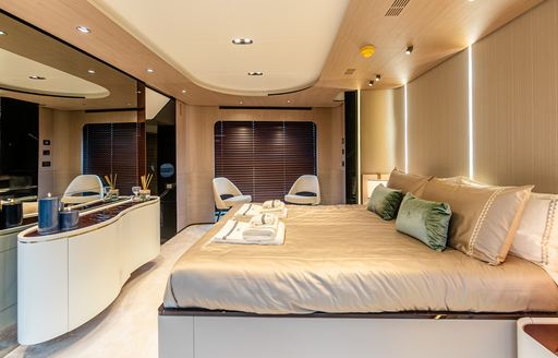 Master cabin onboard charter yacht VESTA, central berth facing a large mirror
