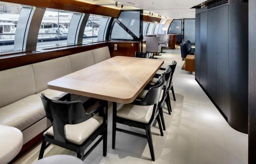 dining inside in the contemporary interior of luxury yacht VERTIGO 