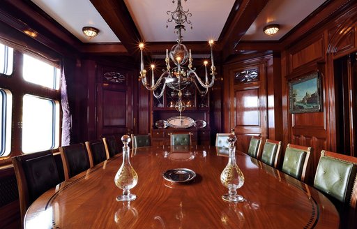 dining table and chandelier on board expedition yacht steel