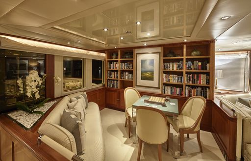 upper deck lounge with bookshelves on board luxury yacht KANALOA 