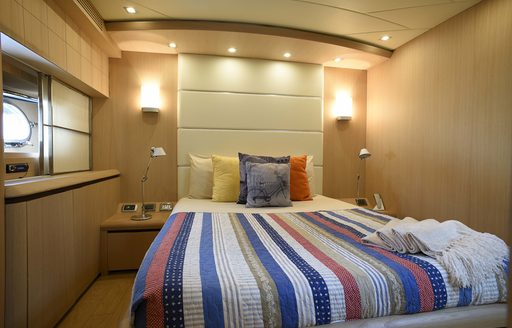 double guest cabin with light wooden walls and joinery on board motor yacht Silver Mama