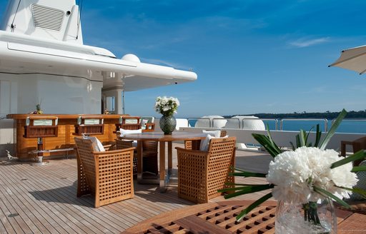 teak-clad bar and seating areas on sundeck of motor yacht BOADICEA 