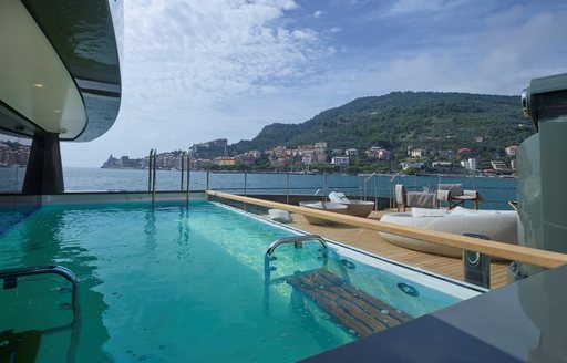 infinity pool with contra jet on main deck of charter yacht MOKA
