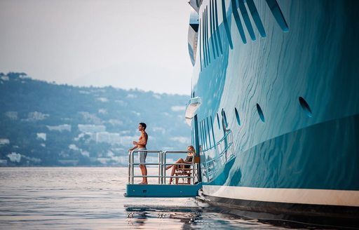 Man overlooking the Mediterranean onboard luxury yacht charter SUNRAYS 