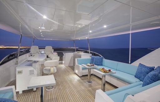 chic flybridge with comfortable lounge and helm on board charter yacht ‘Lady Carmen’
