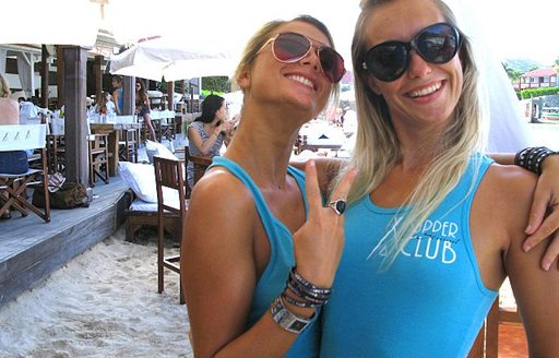 Two girls celebrating at a bar in St Barts