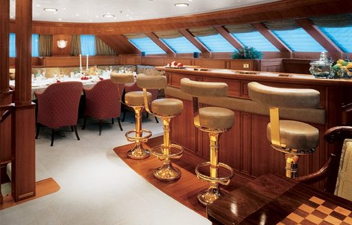 Indoor bar and formal dining on board charter yacht Spirit oif the C's