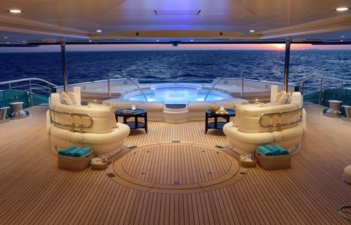 Jacuzzi pool lit up on deck of Superyacht SUNRAYS