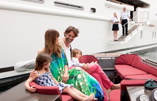 Happy family enjoying their yacht charter