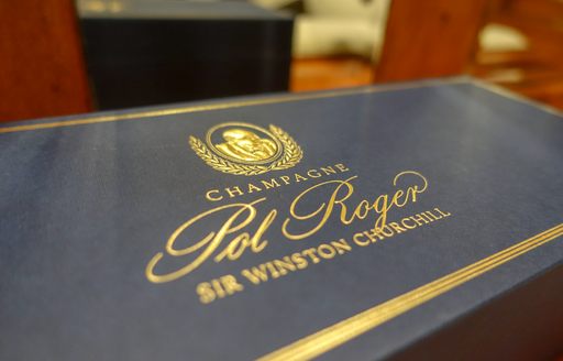 detailed shot of winston churchill champagne box in main salon of luxury motor yacht over the rainbow