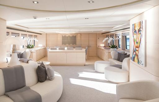 Main salon onboard luxury yacht charter G3, spacious lounge area with windows on either side