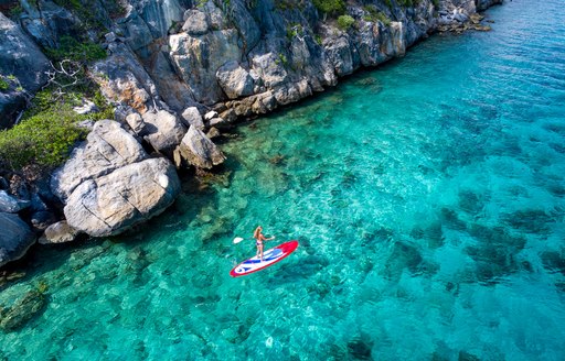 paddle boarding in clear water in the us virgin islands