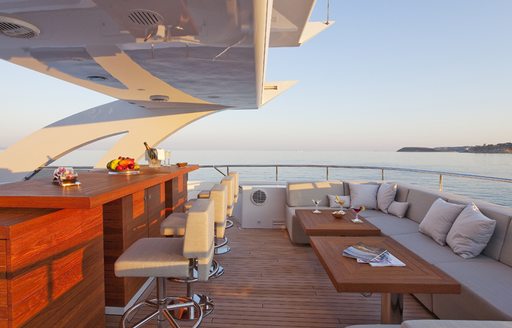 alfresco bar and lounging area on sun deck of motor yacht JEMS