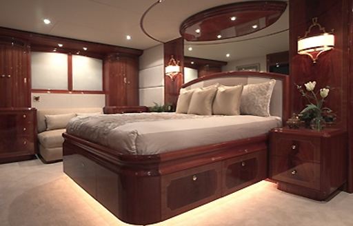 full-beam master suite with high-gloss Cherrywood joinery on board superyacht ‘Le Reve’ 