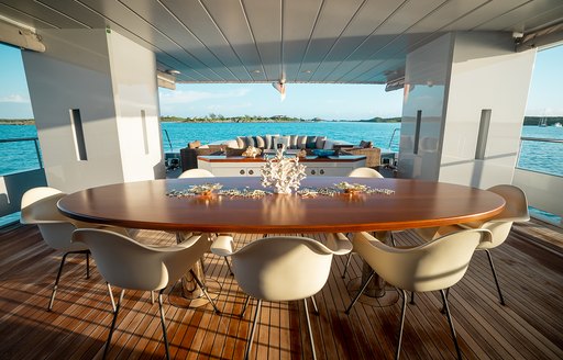 Exterior dining set up on the aft main deck of charter yacht ONLY NOW